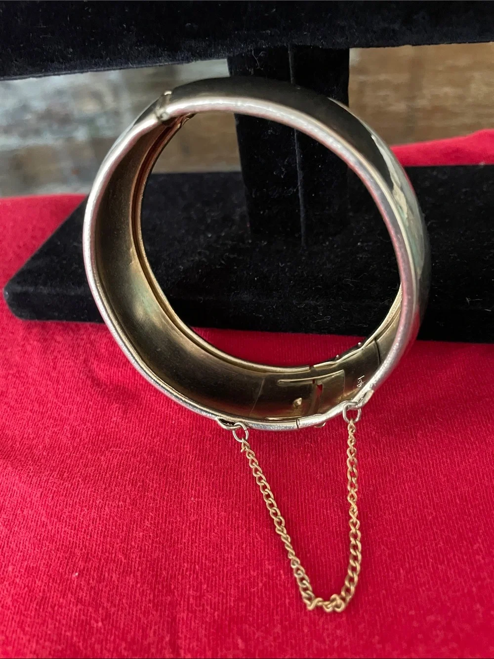 Polished Silver-Tone Hinged Bangle Bracelet with Safety Chain